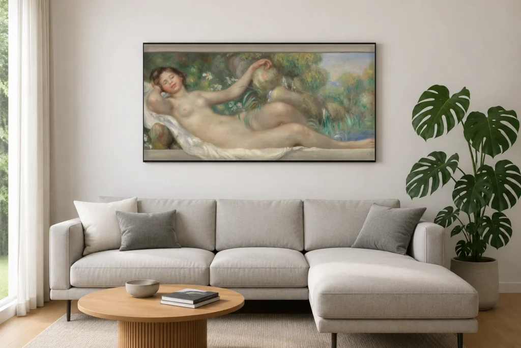 Framed print of Reclining Nude (La Source) hanging on a wall in a furnished room