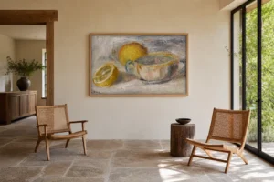 Framed print of Still Life With Lemons hanging on a wall in a furnished room