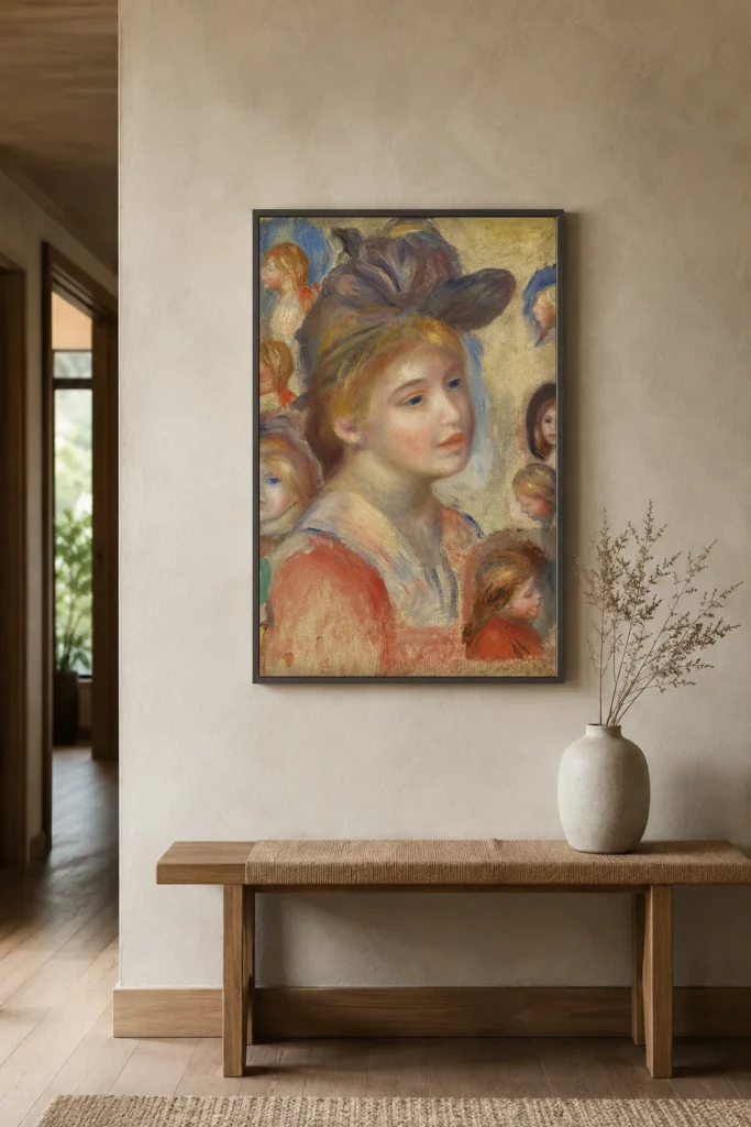 Framed print of Study of Girls’ Heads (Étude de têtes de jeunes filles) hanging on a wall in a furnished room