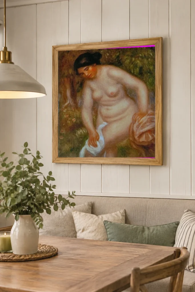 Framed print of Bather Drying Herself hanging on a wall in a furnished room
