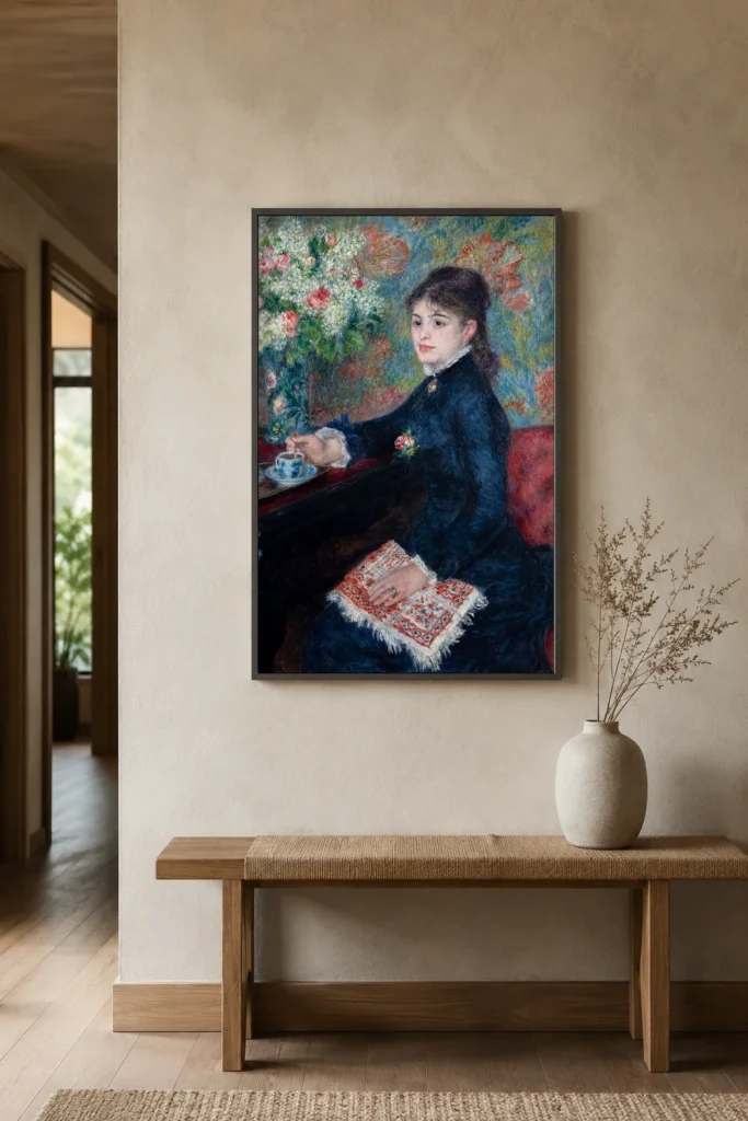 Framed print of The Cup of Chocolate hanging on a wall in a furnished room
