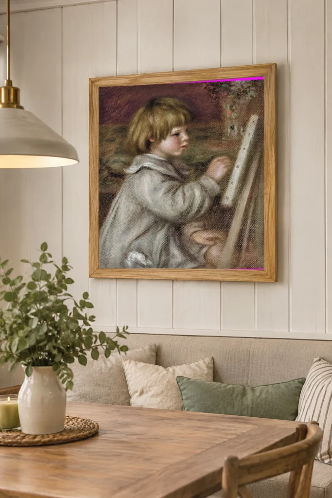 Framed print of The little painter (Claude Renoir) hanging on a wall in a furnished room