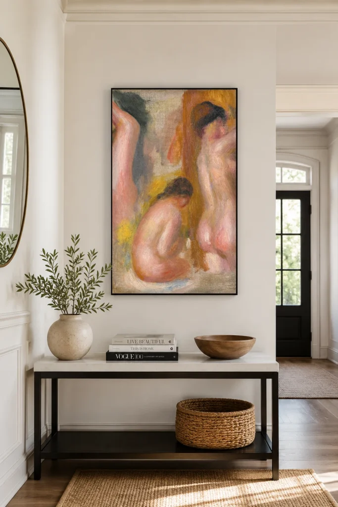 Framed print of Three Bathers hanging on a wall in a furnished room