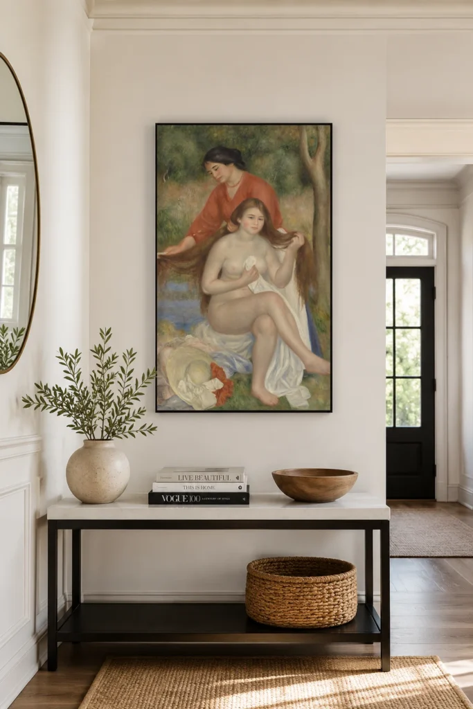 Framed print of Bather and Maid (La Toilette de la baigneuse) hanging on a wall in a furnished room