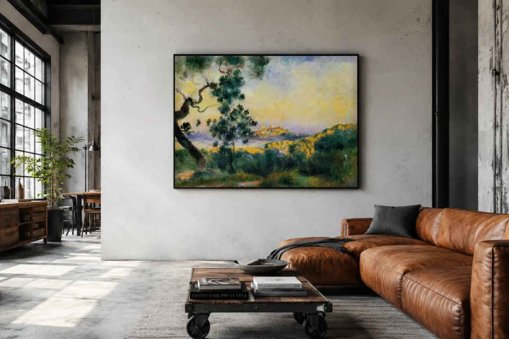 Framed print of View of Antibes hanging on a wall in a furnished room