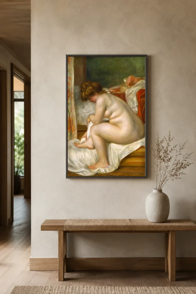 Framed print of Woman After Bath hanging on a wall in a furnished room