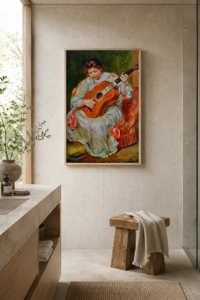 Framed print of Woman Playing a Guitar hanging on a wall in a furnished room