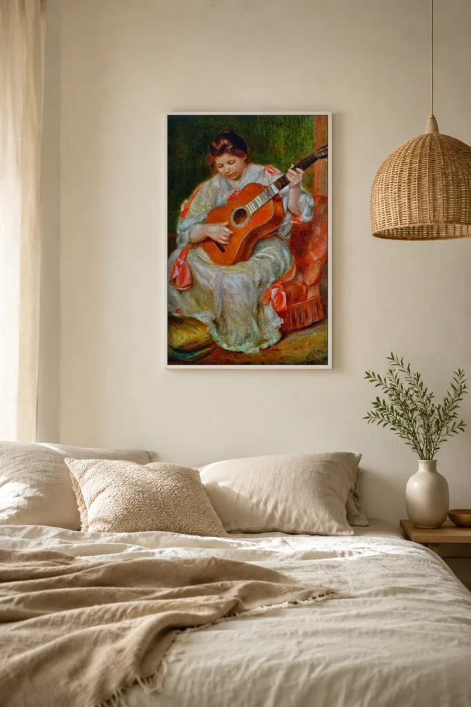 Framed print of Woman Playing a Guitar hanging on a wall in a furnished room