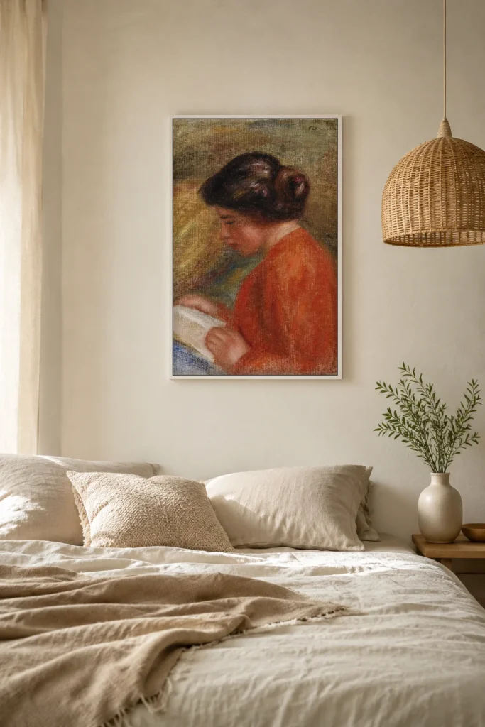 Framed print of Young Woman Reading (Jeune femme lisant, buste) hanging on a wall in a furnished room