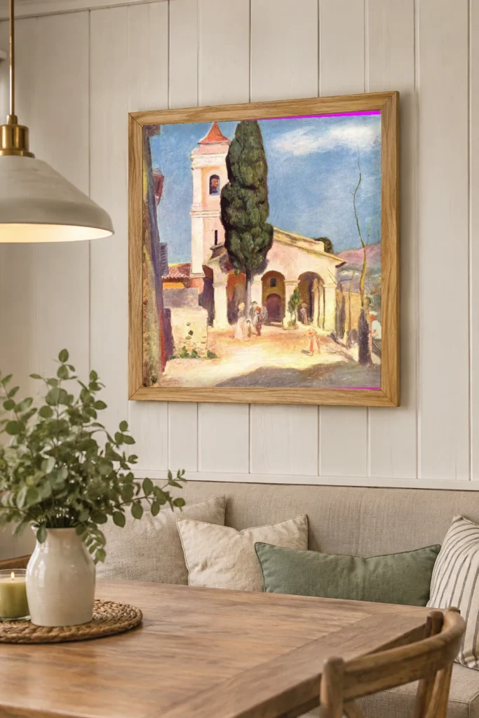 Framed print of Church at Cagnes hanging on a wall in a furnished room