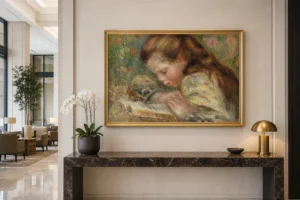 Framed print of Child Reading (Enfant lisant) hanging on a wall in a furnished room