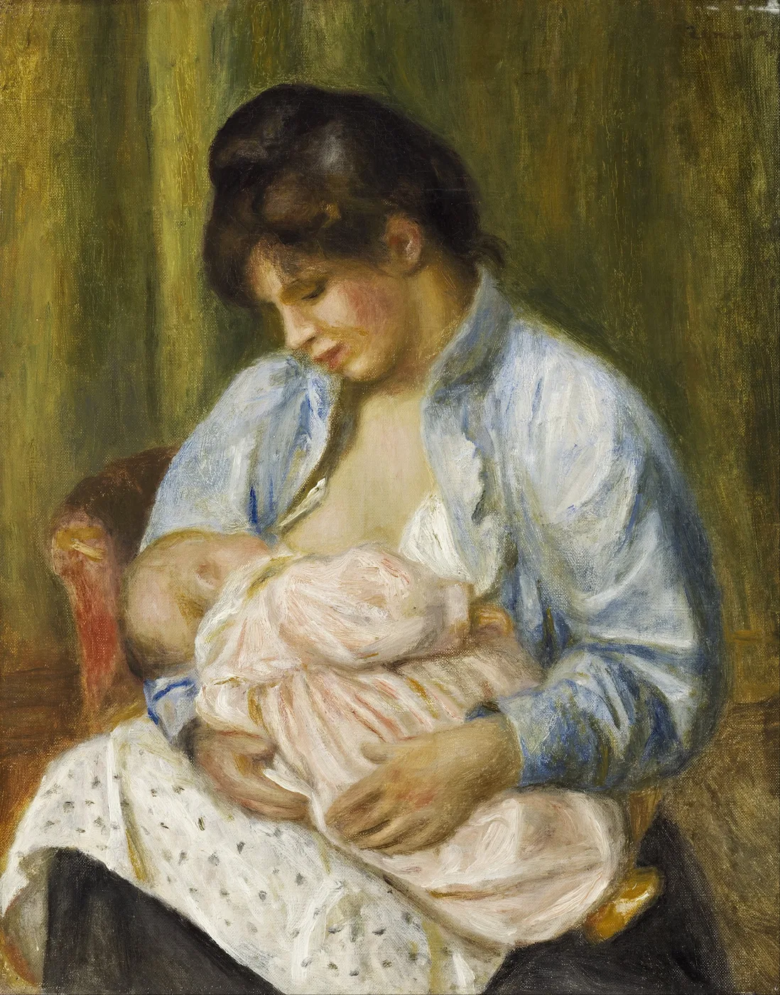 A mother in a blue open blouse nurses an infant wrapped in pink and white, seated in a red armchair against a dark green background