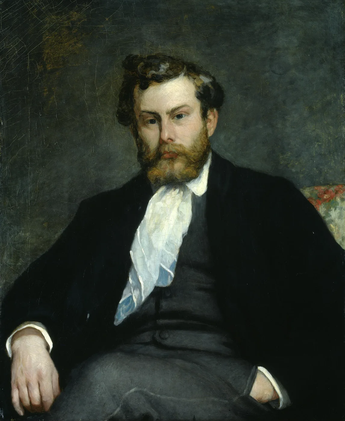 A young bearded man in a dark suit and loose white cravat seated in an armchair, painted in muted grey and green tones