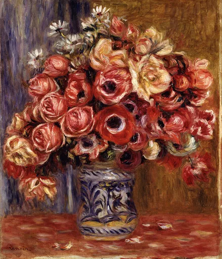 A dense bouquet of red anemones, pink roses, and white daisies in a blue and white patterned vase on a red tablecloth