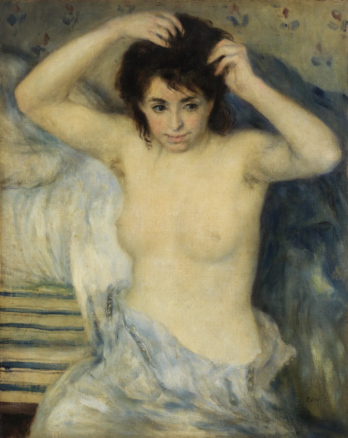 A bare-chested young woman arranging her dark hair with both hands, draped in white and blue cloth indoors, in cream, blue and rosy flesh tones