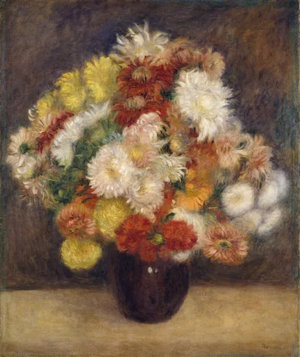 A dense bouquet of shaggy chrysanthemums in a dark round vase on a table, in white, yellow and rust orange against a dark brown backdrop
