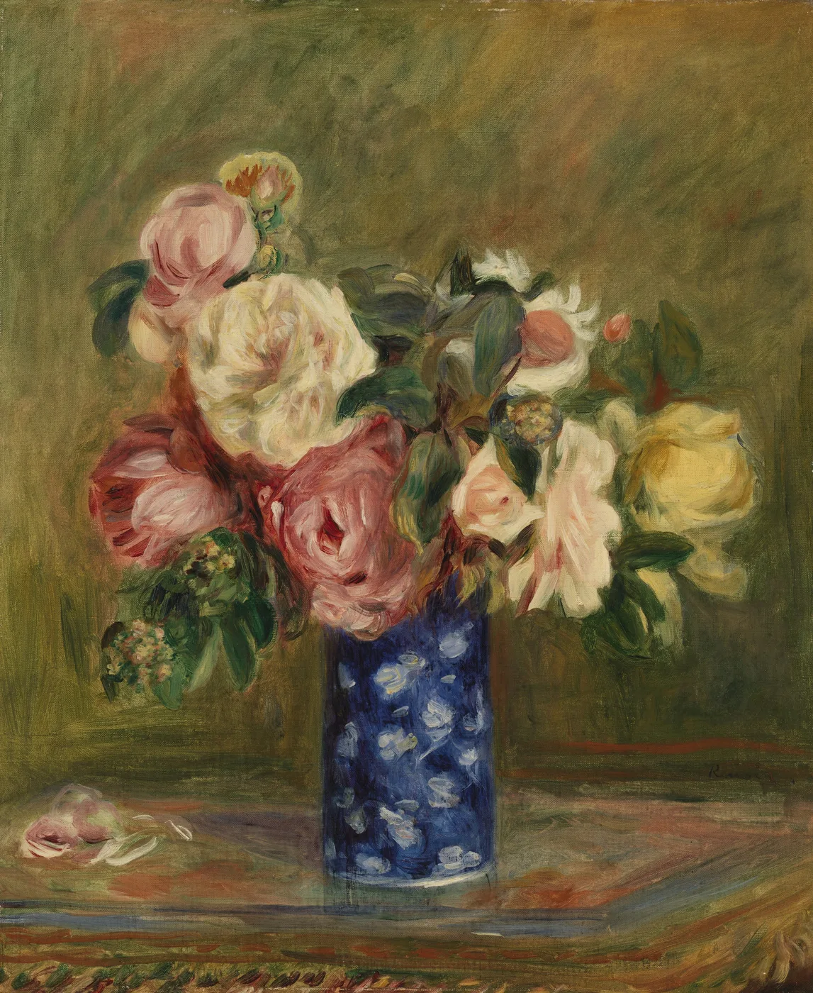 Pink, white and yellow roses in a blue and white speckled vase on a patterned cloth, against an olive-green background