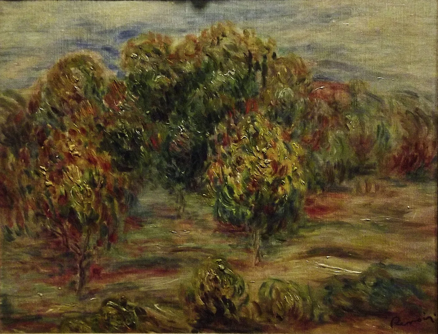 A cluster of thick, leafy trees with rust red foliage in an open field, painted with heavy impasto in green, ochre, and red