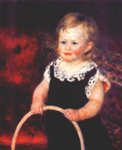 A toddler in a black dress with a white lace collar grips a large wooden hoop, against a deep red background.