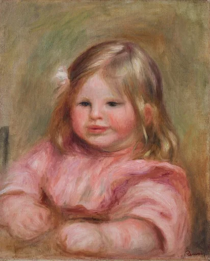 A close portrait of a round faced child in pink with a white hair bow, against an olive background