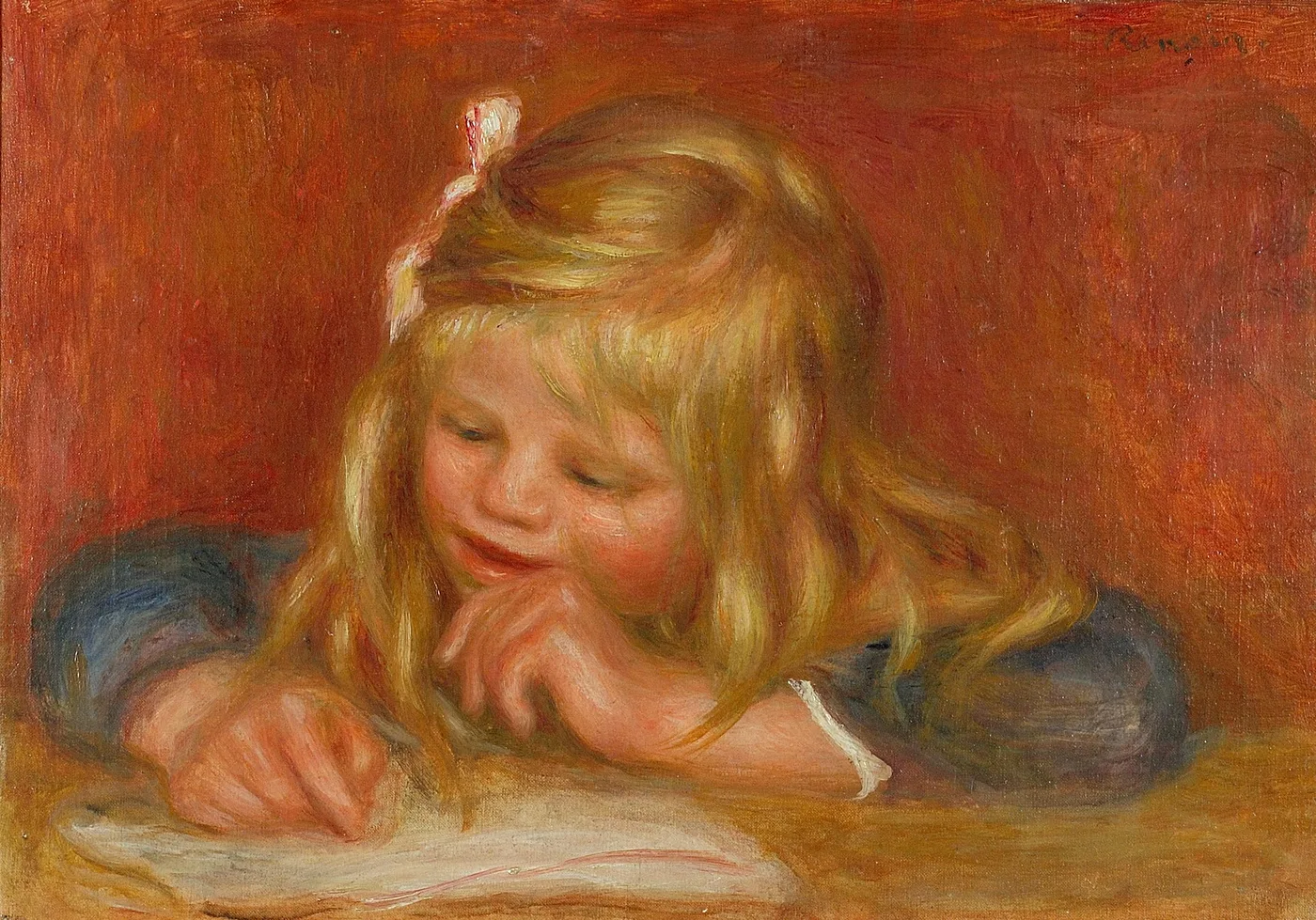 A blonde child with a hair ribbon leaning over a book on a table, chin resting on hand, against a warm reddish orange background