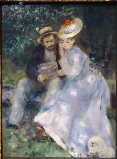 A man and woman in a straw boater hat reading together outdoors, in dark green foliage with pale blue and white