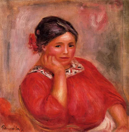 A woman with a red flower in her hair rests her chin on her hand, wearing a red blouse against a soft pink background