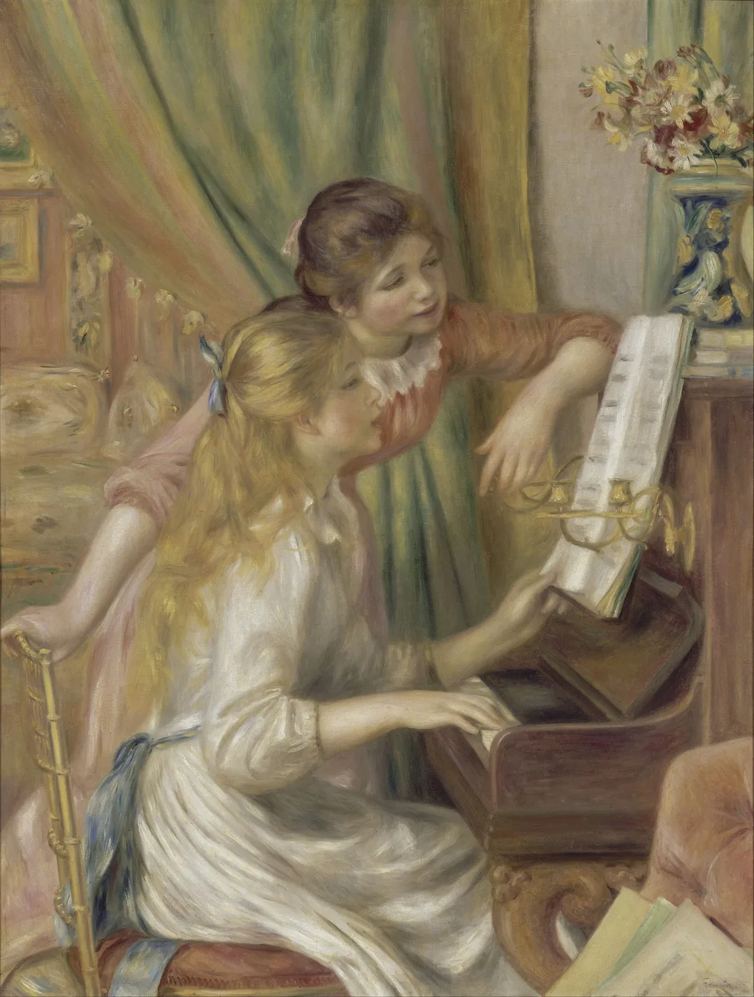 Two girls at an upright piano, one playing and one leaning in to read the sheet music, in a warm room of cream, pink and gold