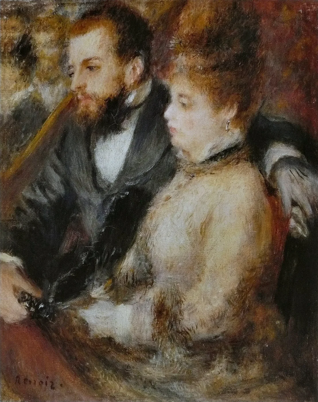 A bearded man in a dark suit and a woman in a cream dress seated together in a theatre box, in warm red tones