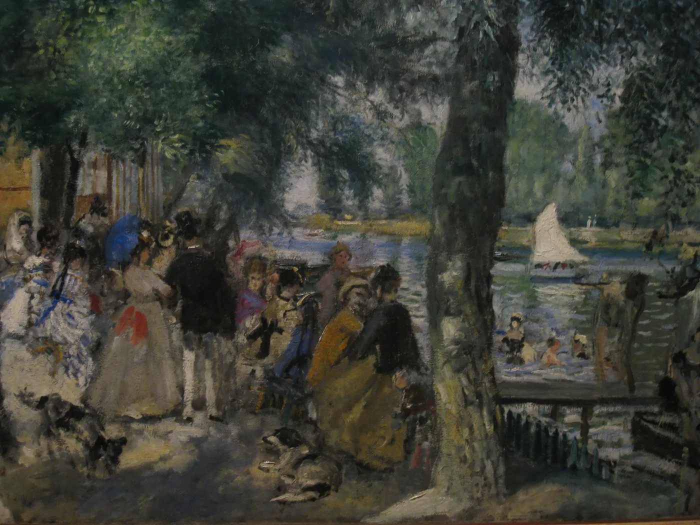 Fashionably dressed Parisians and dogs gather under trees by a riverside bathing spot with a sailboat and swimmers, in dark green, blue, and gold