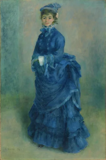 A woman in a voluminous deep blue dress and matching feathered hat stands against a muted blue-green backdrop