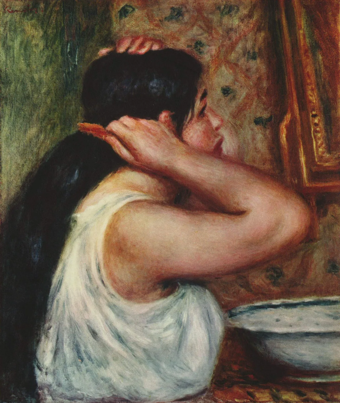 A woman in a white slip seen from behind combing her dark hair beside a washbasin, against warm reddish patterned wallpaper