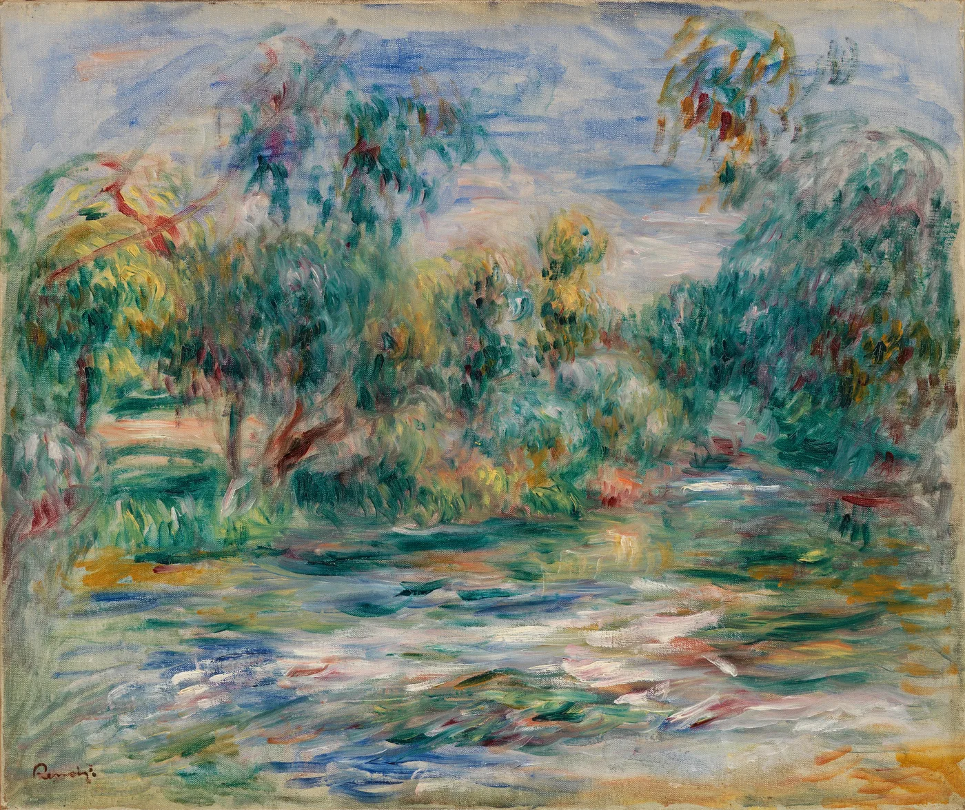 A pond bordered by dense trees reflects shimmering green and orange hues beneath a pale blue sky.