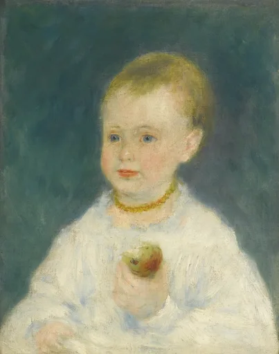 A toddler in a white dress and amber necklace holds an apple, against a dark teal-green background.