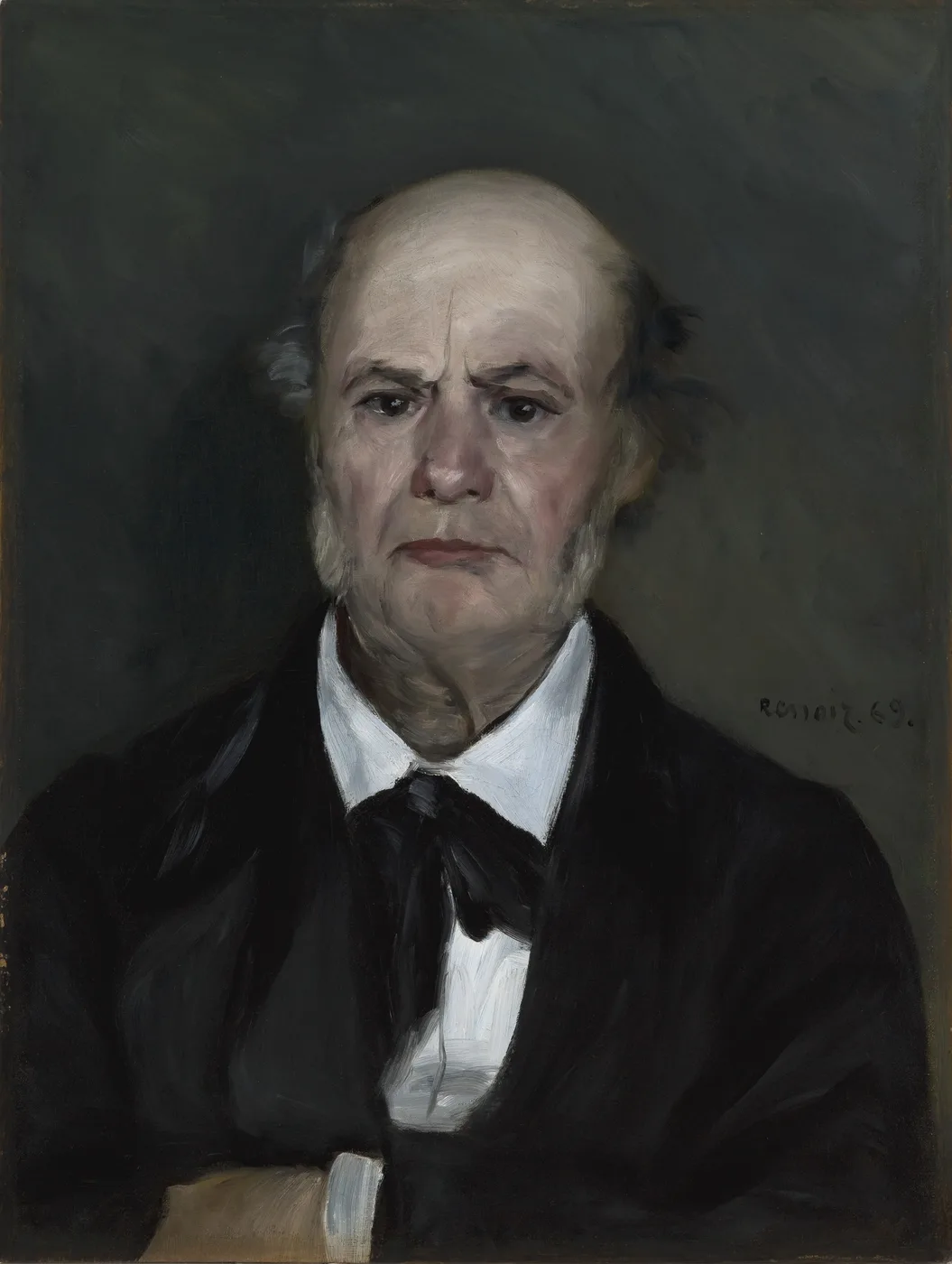 A bald elderly man with a stern expression is shown bust length in a dark suit and white collar against a plain dark brown background