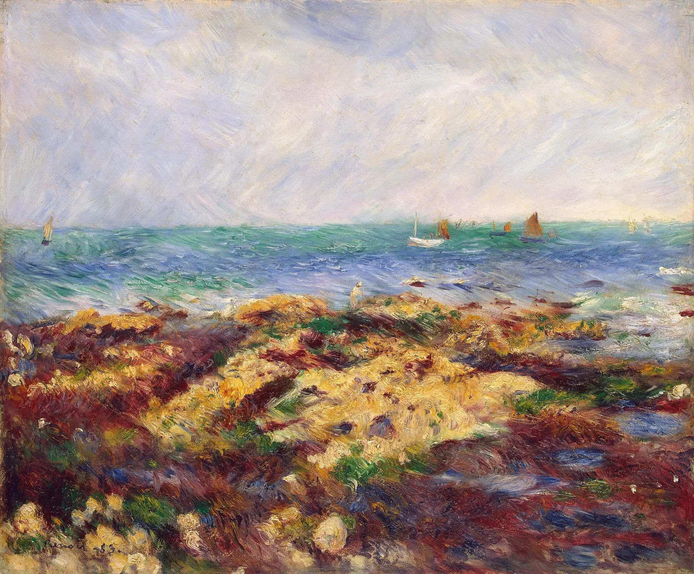 A rocky, seaweed-covered shore exposed at low tide, a lone figure on the rocks, sailboats on the green-blue sea under a cloudy sky.
