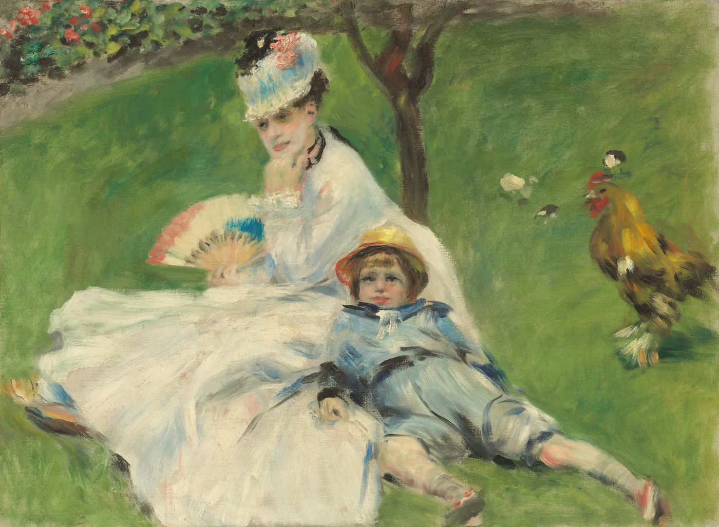 Woman in a white dress and feathered hat fans herself on the grass while a boy in blue lies beside her near a rooster.