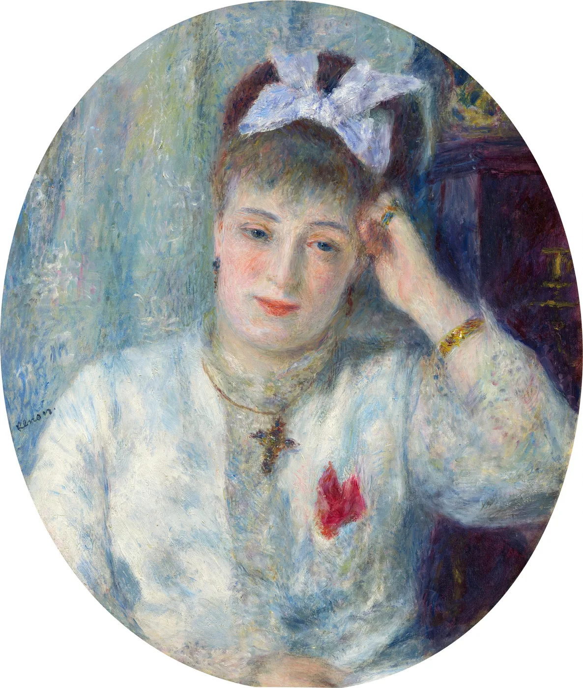 A woman in an oval portrait wears a white bow in her hair and a cross necklace over a white blouse with a red accent.