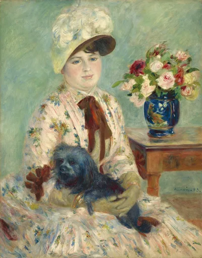 A woman in a white feathered bonnet and floral dress holds a small black dog, a vase of pink roses on the table beside her.