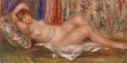 A nude woman reclines on her back, one arm raised behind her head, against a floral pillow and patterned curtain.