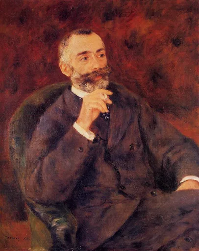 A bearded man in a dark suit sits in a green armchair, his hand raised near his chin, against a deep red background.