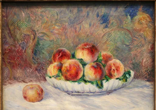 A still life of ripe peaches piled in a white bowl on a white tablecloth with a patterned background, in red, orange, and cream tones.
