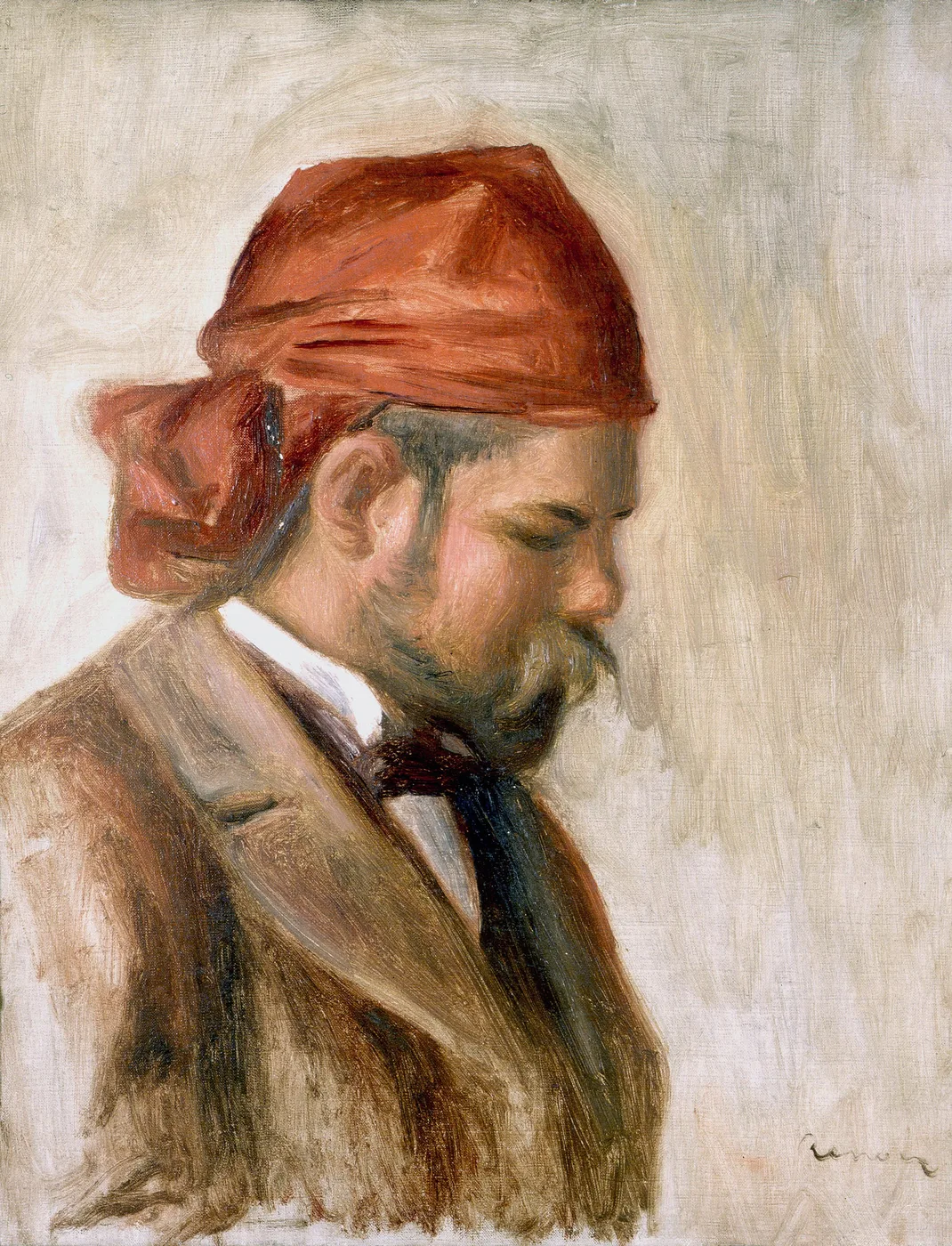 A bearded man in profile wearing a red headscarf and brown jacket with a dark necktie, against a pale beige background