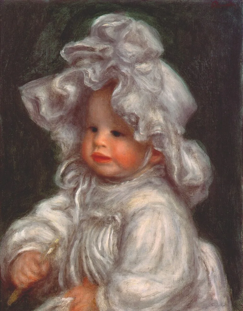 A young child in a large frilled white bonnet and white dress, against a dark green background.