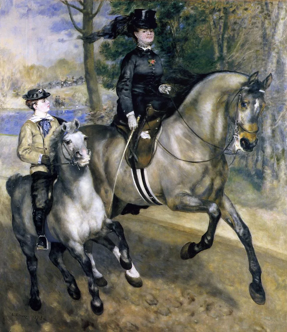 A woman in a black riding habit and top hat on a grey horse beside a boy on a pony, riding through a wooded park by a lake