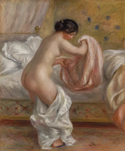 A nude woman stands beside a bed gathering a pink cloth in her hands, white drapery pooling at her feet in a warm-toned bedroom.