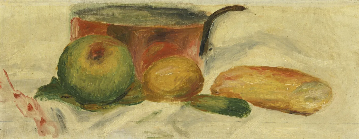 A copper pan sits behind an apple, a lemon and a loaf of bread on a white cloth, against a warm cream background.