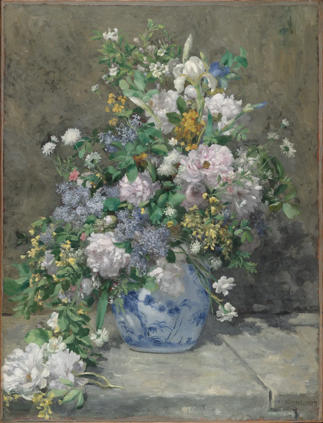 A lush bouquet of white peonies, pink roses and blue lilac in a blue-and-white porcelain vase, set against an olive-grey wall