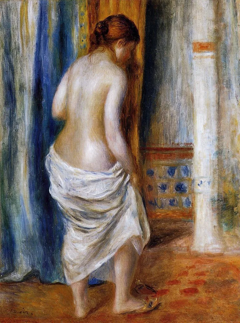 A nude woman seen from behind wraps white cloth around her hips before a blue and orange tiled niche.