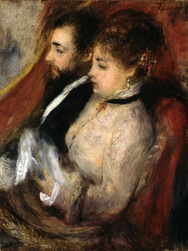 A bearded man in evening dress and a woman in a white blouse with flowers in her hair sit together, set against a deep red backdrop